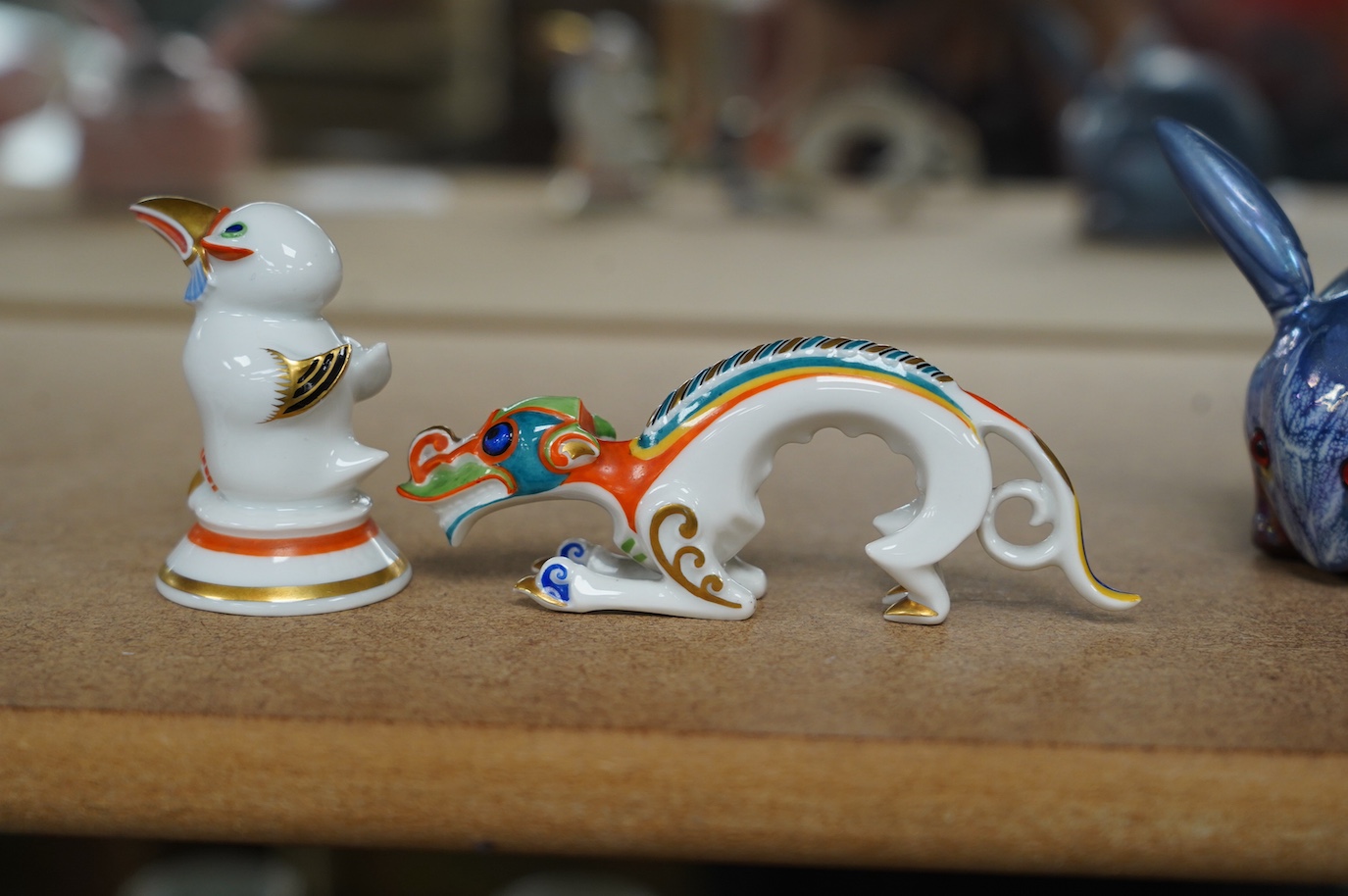 Two Art Deco Rosenthal Selb Bavaria small figures, modelled by Hans Küster, c.1925, comprising 'Schwenk', a Chinese river dragon 11.5cm long, and a stylised bird, 6cm high, Condition - good